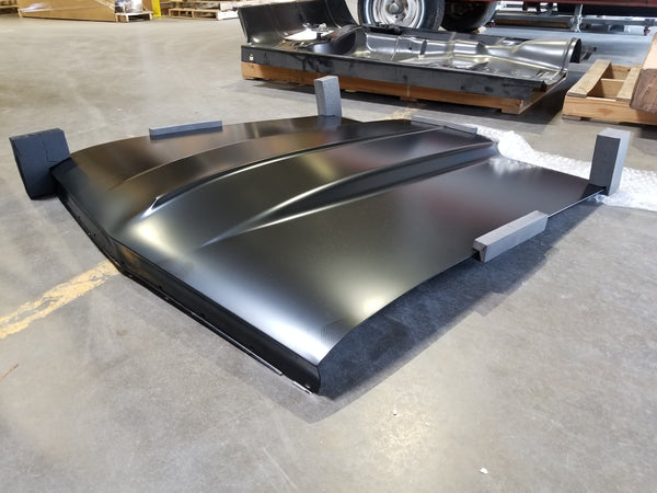 Large hood - black - on a concrete floor. 1966 Chevy Chevelle Cowl 2IN Induction Hood, New Tooling.