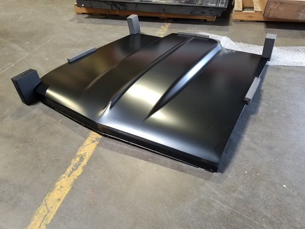 Large hood - black - on a concrete floor. 1966 Chevy Chevelle Cowl 2IN Induction Hood, New Tooling.