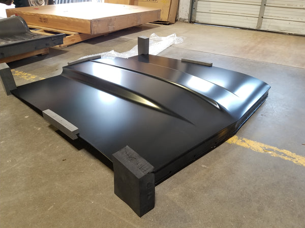 Large hood - black - on a concrete floor. 1966 Chevy Chevelle Cowl 2IN Induction Hood, New Tooling.