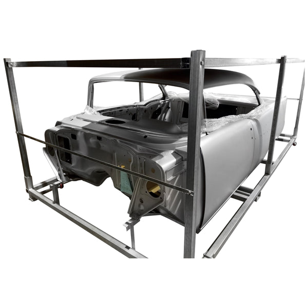Car body shell on a metal frame against a white background. 1957 Chevy Hardtop Body Shell.