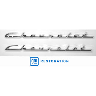 Two chrome Chevrolet emblems with GM Restoration logo on a white background. 1955-1956 Chevy Chevrolet Script Set, Pair, Chrome.
