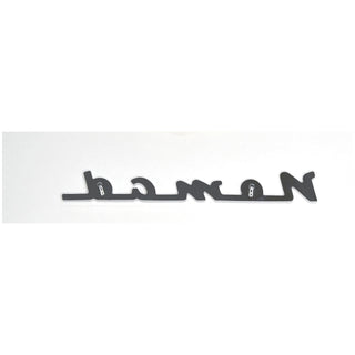 Metallic emblem with 'Nomad' branding on a white background. 1955-1958 Chevy Nomad Chevrolet Nomad Script, Chrome.