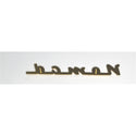 Gold 'Nomad' logo on a white background. 1955-1957 Chevy Nomad Chevrolet Nomad Script, Gold Plated.