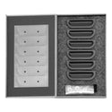 Set of gray plastic components in a box on a white background. 1957 Chevy Fender Louver Set, Black.
