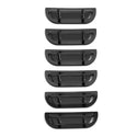 Set of six black plastic car fender flares on a white background. 1957 Chevy Fender Louver Set, Black.