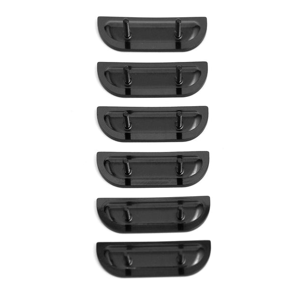 Set of six black plastic car fender flares on a white background. 1957 Chevy Fender Louver Set, Black.