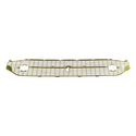 Metal grille on a white background. 1957 Chevy Gold Grille.