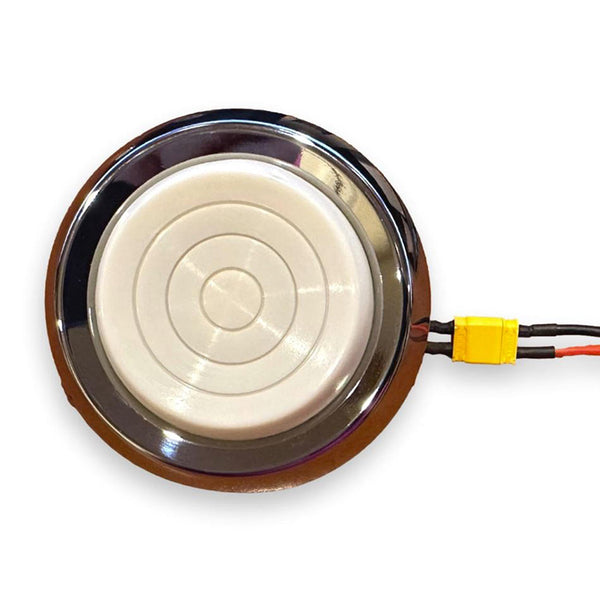 Round metallic object with a white central disc on a white background. 2-Door Hardtop Dome Light.