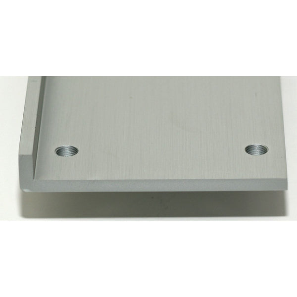 Metallic square block with two holes on a white background. 1955-1957 Chevy 2-Door and 4-Door Bench Seat Relocation Brackets With Grade 8 Bolts Front Bench Seats.