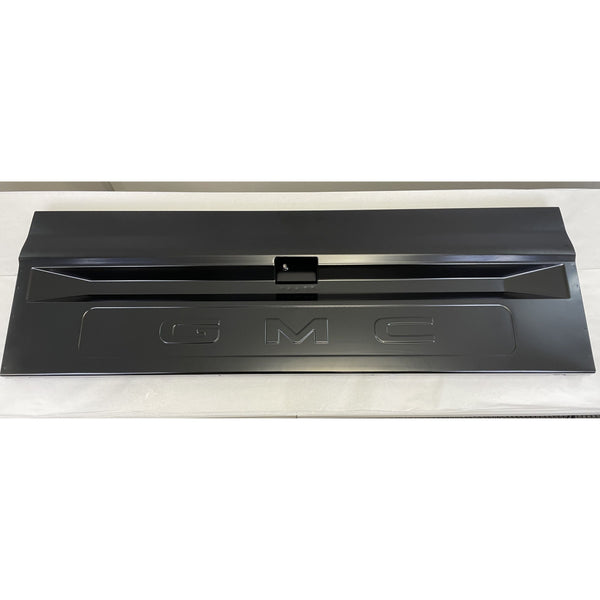 Black GMC car hood on a white background. Tailgate Fleetside With Access Panel For Tailgate Handle.