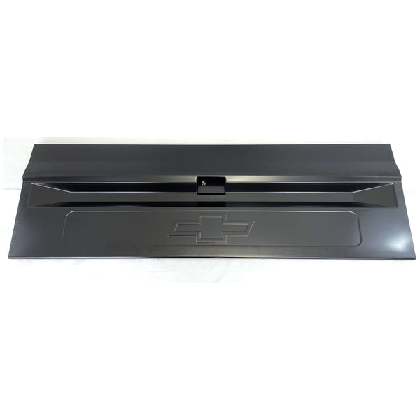 Black metal car bumper with Chevrolet logo on a white background. Tailgate Bowtie Chevrolet Logo Fleetside With Access Panel For Tailgate Handle.