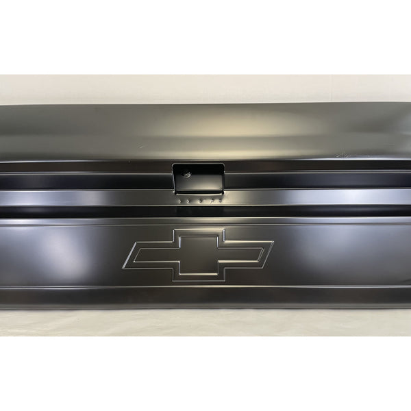 Metal toolbox with Chevrolet logo on a white background. Tailgate Bowtie Chevrolet Logo Fleetside With Access Panel For Tailgate Handle.
