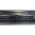 Close-up of a Chevrolet logo on a car door handle. 1967-1972 Chevy C10 Pickup Tailgate Chevrolet Fleetside With Access Panel For Tailgate Handle.