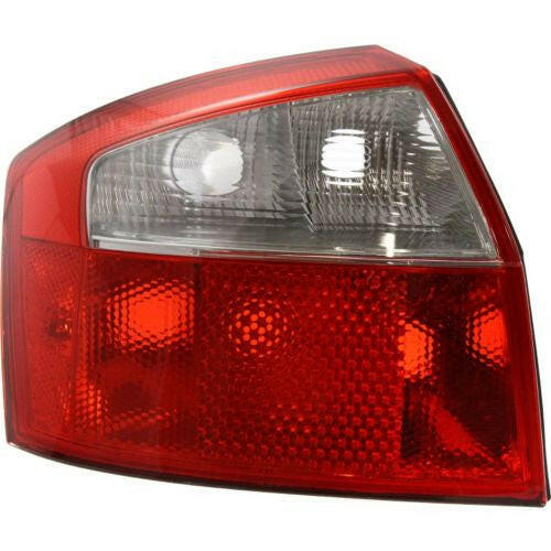 2002-2005 Audi A4 Tail Lamp LH, Lens And Housing, Base Model, Sedan.