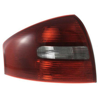 1998-2001 Audi A6 Tail Lamp LH, Lens And Housing, Sedan.